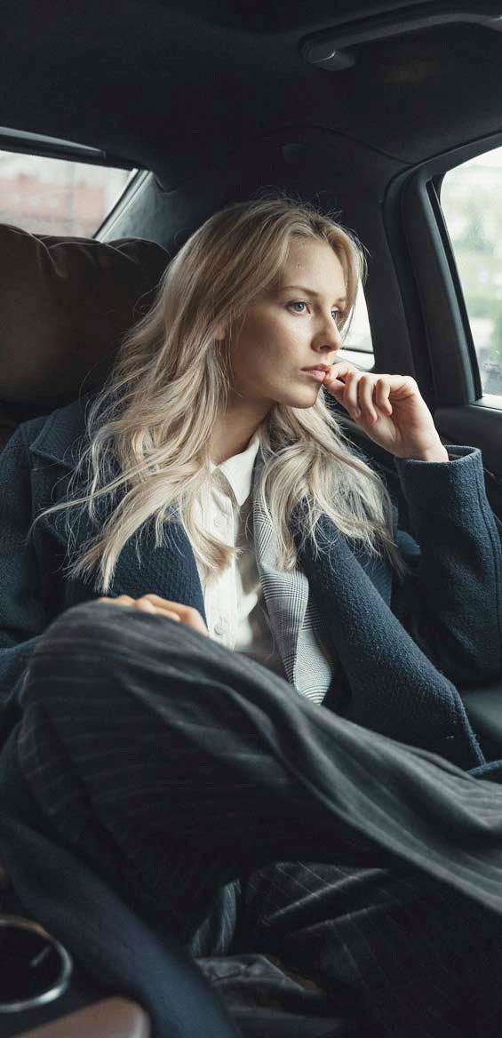 Blonde Business Lady Staring Out The Window